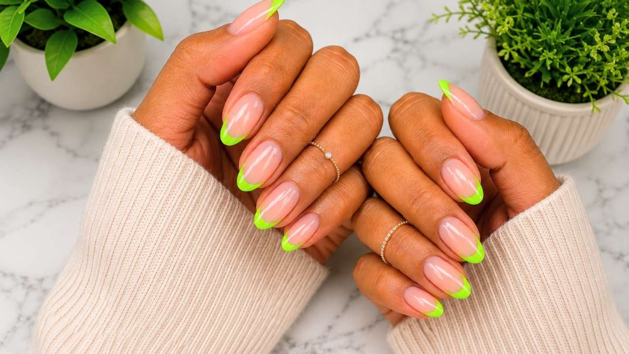 Professional nail extensions in Vaishali Ghaziabad featuring almond-shaped French tip designs